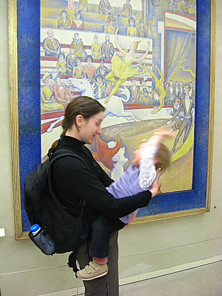Our own little circus queen in front of Seurat's "Circus," 1891.